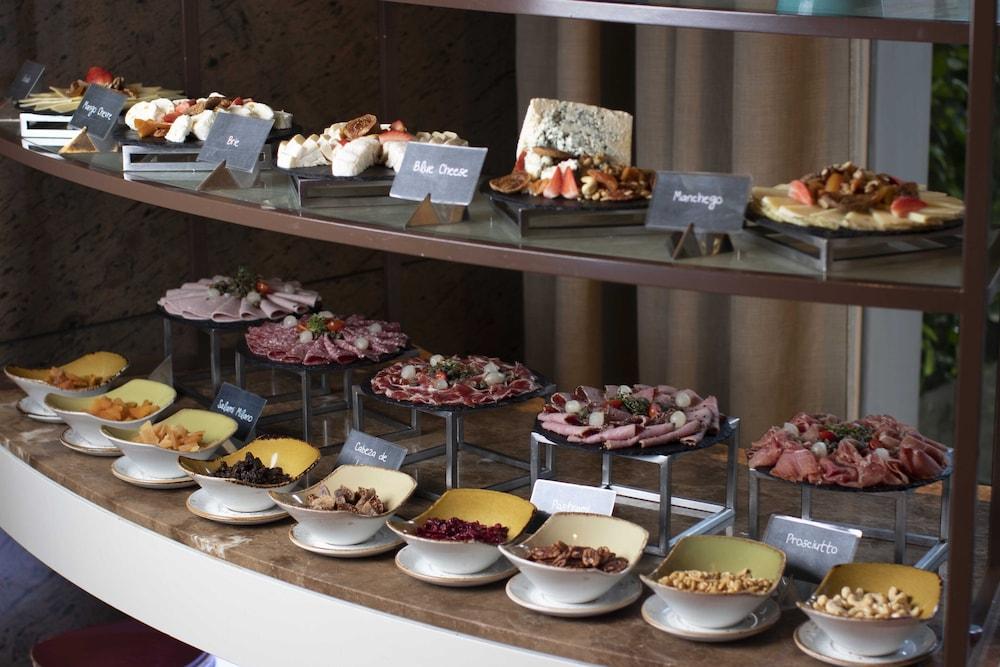 Discovery Primea Makati City Екстериор снимка A selection of cold cuts and cheese at a buffet